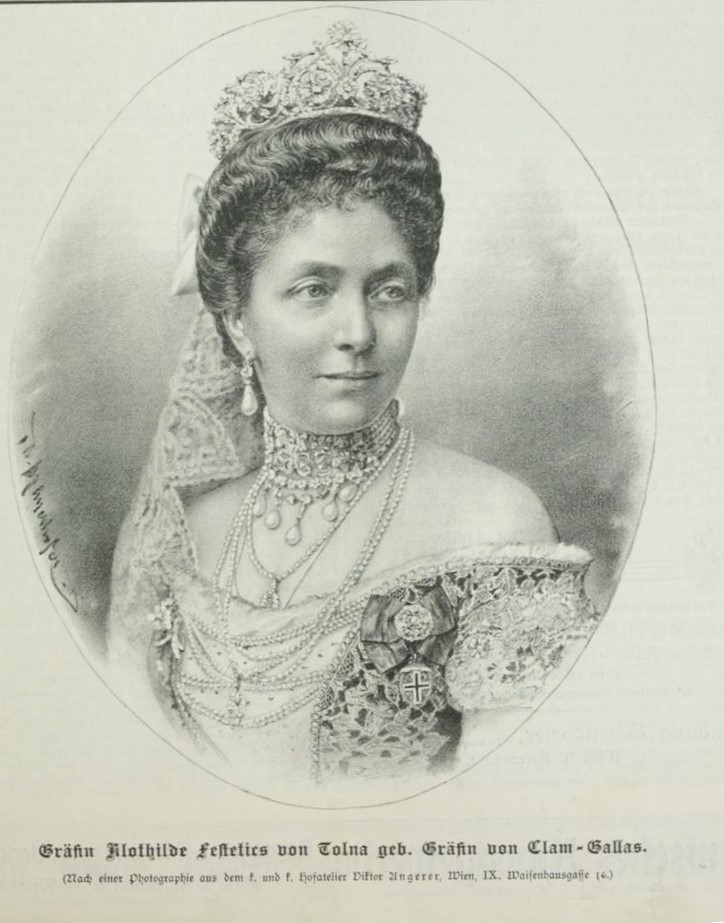 Kmotra Clotildy - Clotilde Festetics de Tolna (1859-1947), rozená Clam-Gallas, sestra hraběte Franze Clam-Gallase. Spolumajitelka rozsáhlých velkostatků v Čechách a na Moravě. Do roku 1945 byl jejím sídlem zámek Pohled. Zdroj:https://anno.onb.ac.at/cgi-content/annoshow?call=wsb